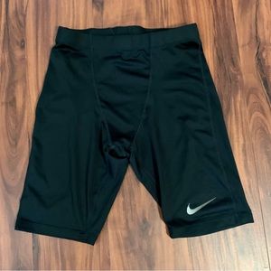 NIKE DRI-FIT TIGHT ATHLETIC SHORTS. ELASTIC WAISTBAND. FIT LIKE A GLOVE.